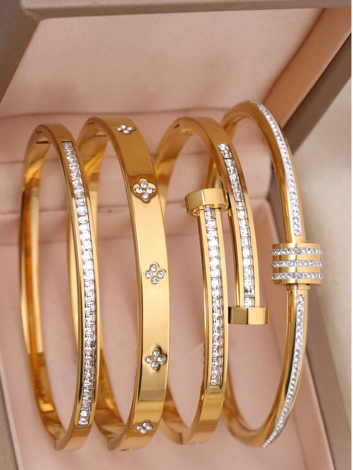4 gold bangles  in Stainless Steel